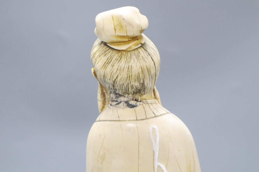 A Chinese simulated ivory figure of an elder, height 37cm